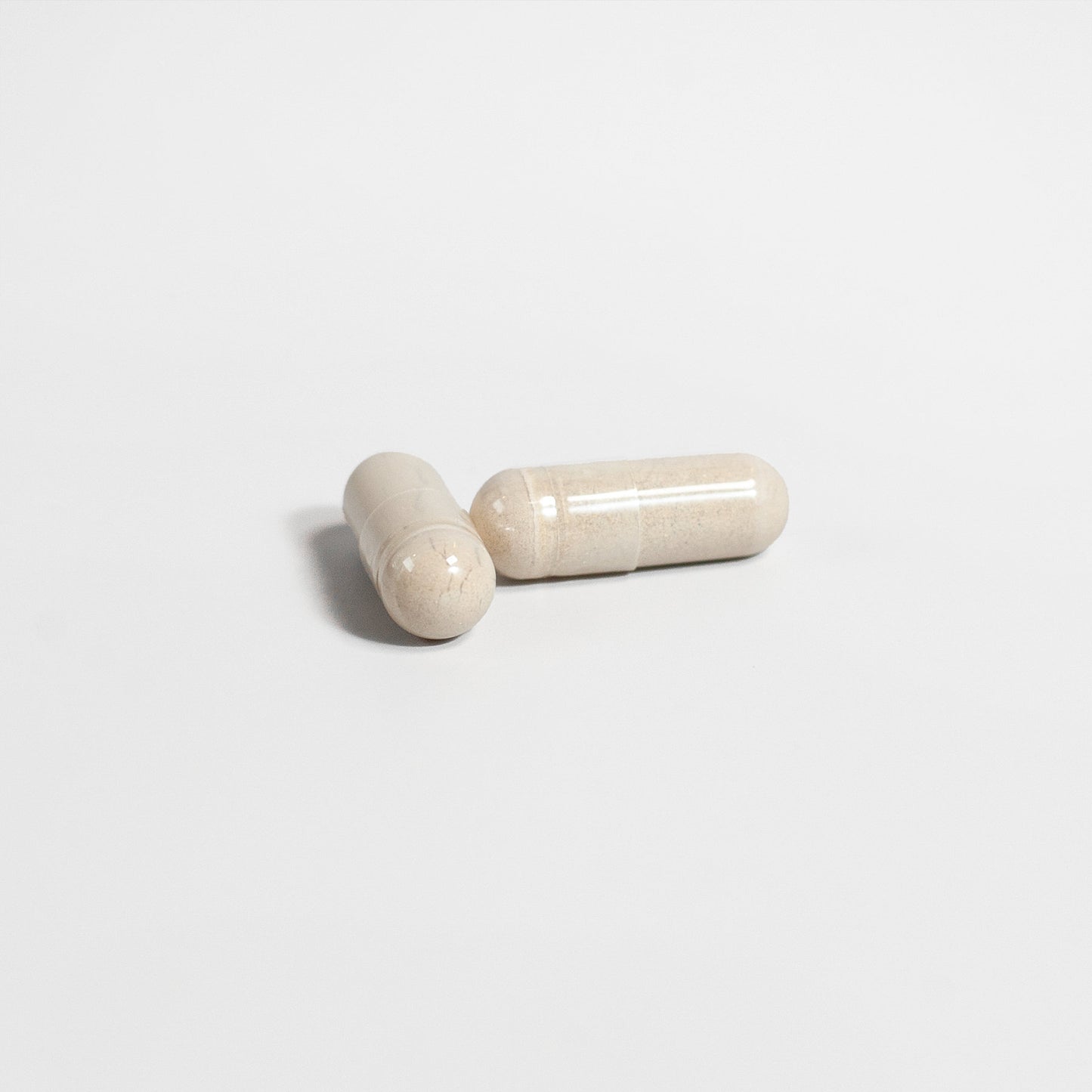 Alpha Energy supplement capsules in a light-colored finish for enhanced vitality and energy
