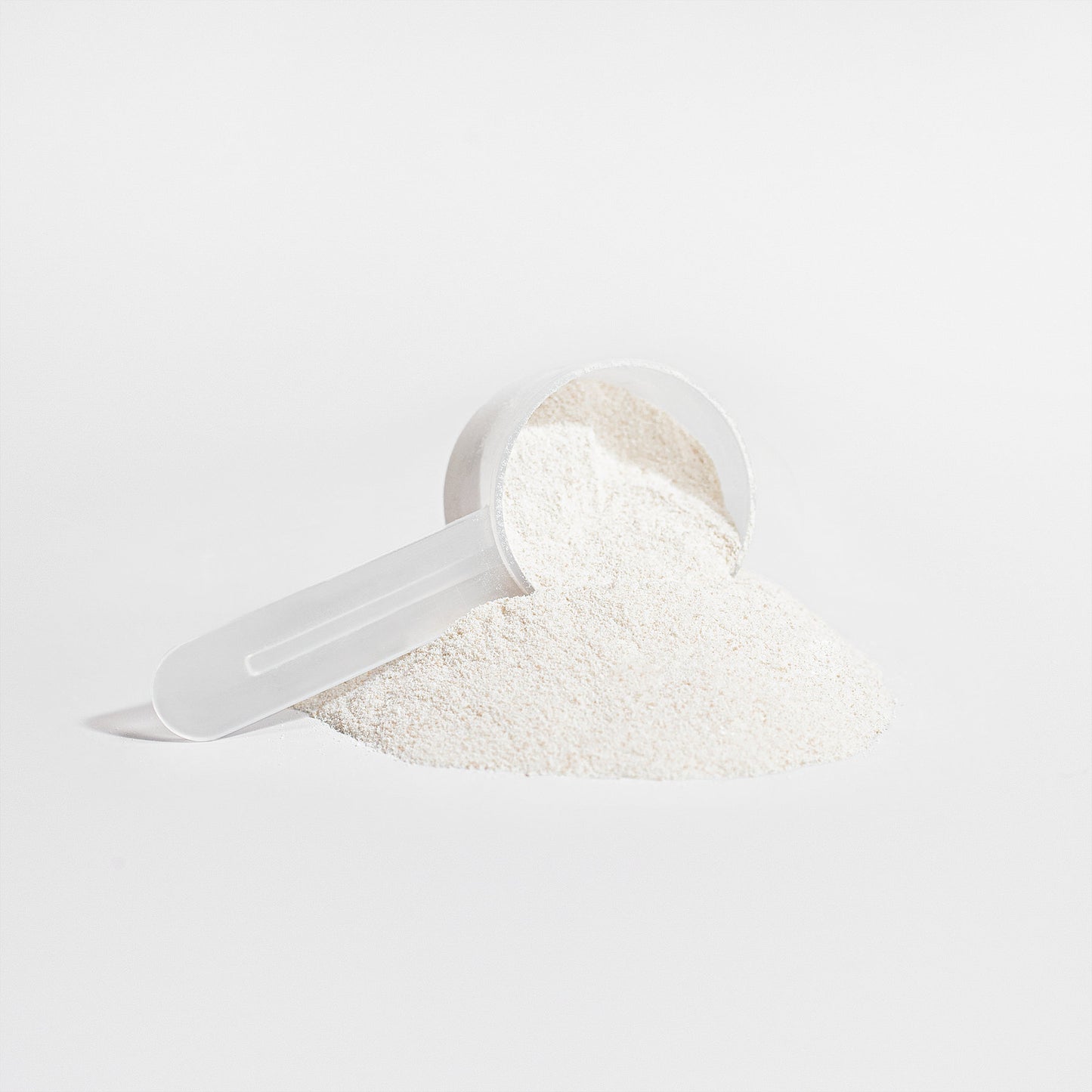 Alpha Omega Vitality grass-fed collagen peptides powder with a measuring scoop for easy serving