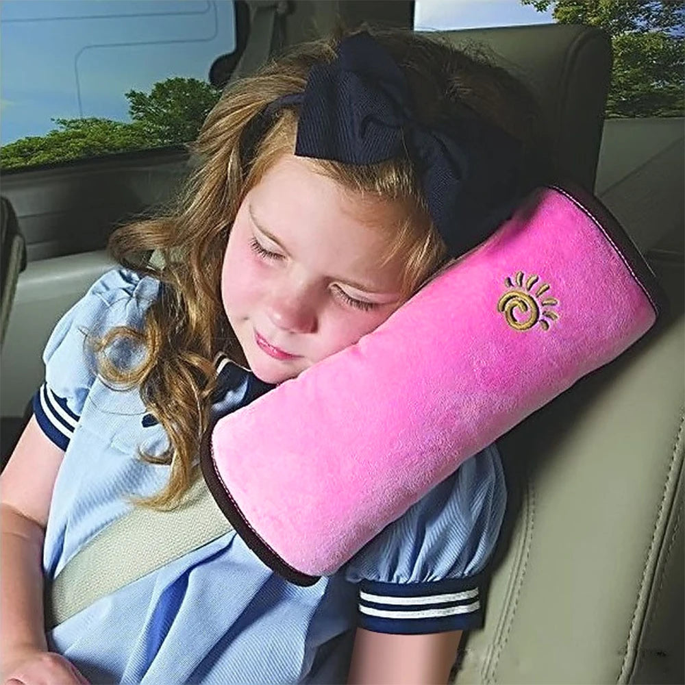 Soft pink children's car seat cushion designed for comfort during road trips and travel.