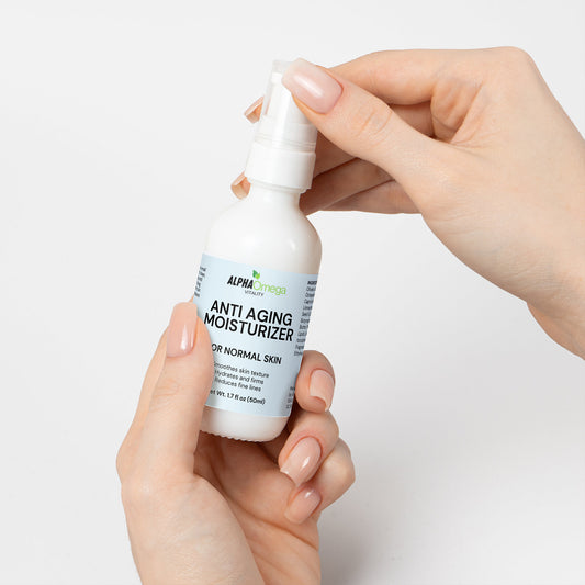 Alpha Omega Vitality anti aging moisturizer for normal skin in a pump bottle held by hands