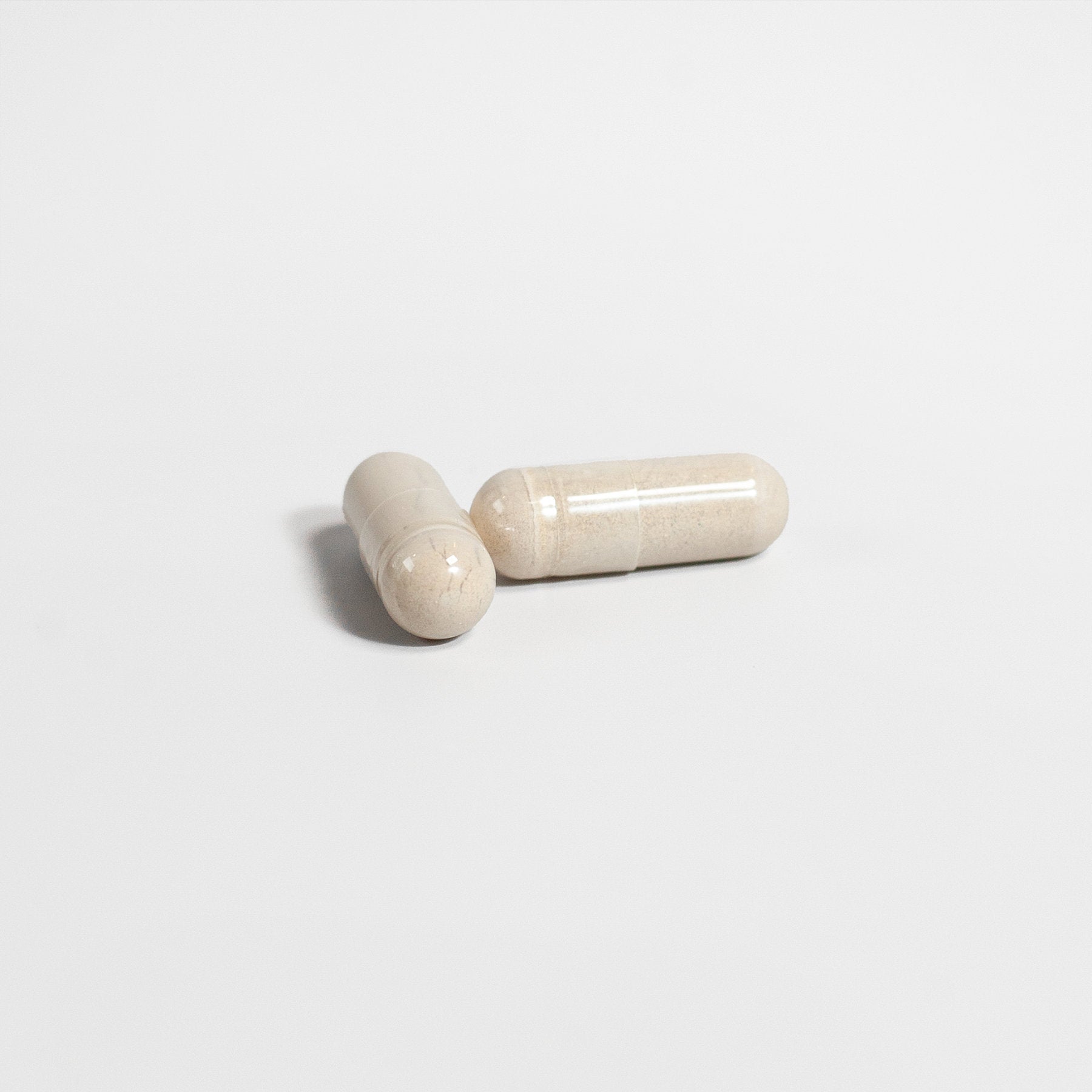 Alpha Energy supplement capsules in a light-colored finish for enhanced vitality and energy