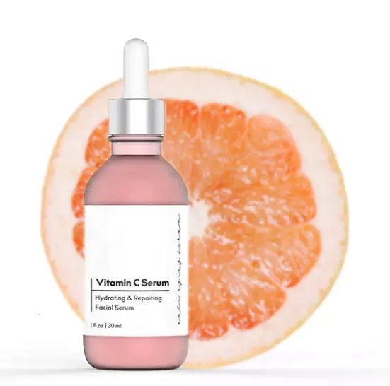 Alpha Omega Vitality premium vitamin C serum in a glass bottle with dropper on a grapefruit background